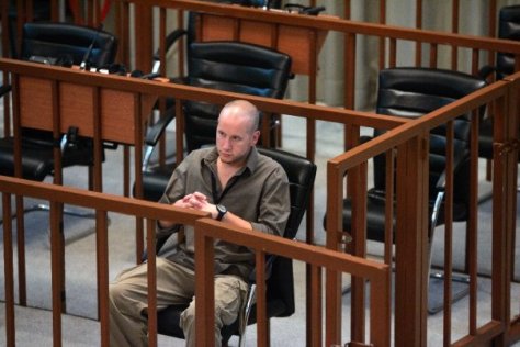 Denn in Saddam's seat at Trial in Baghdad